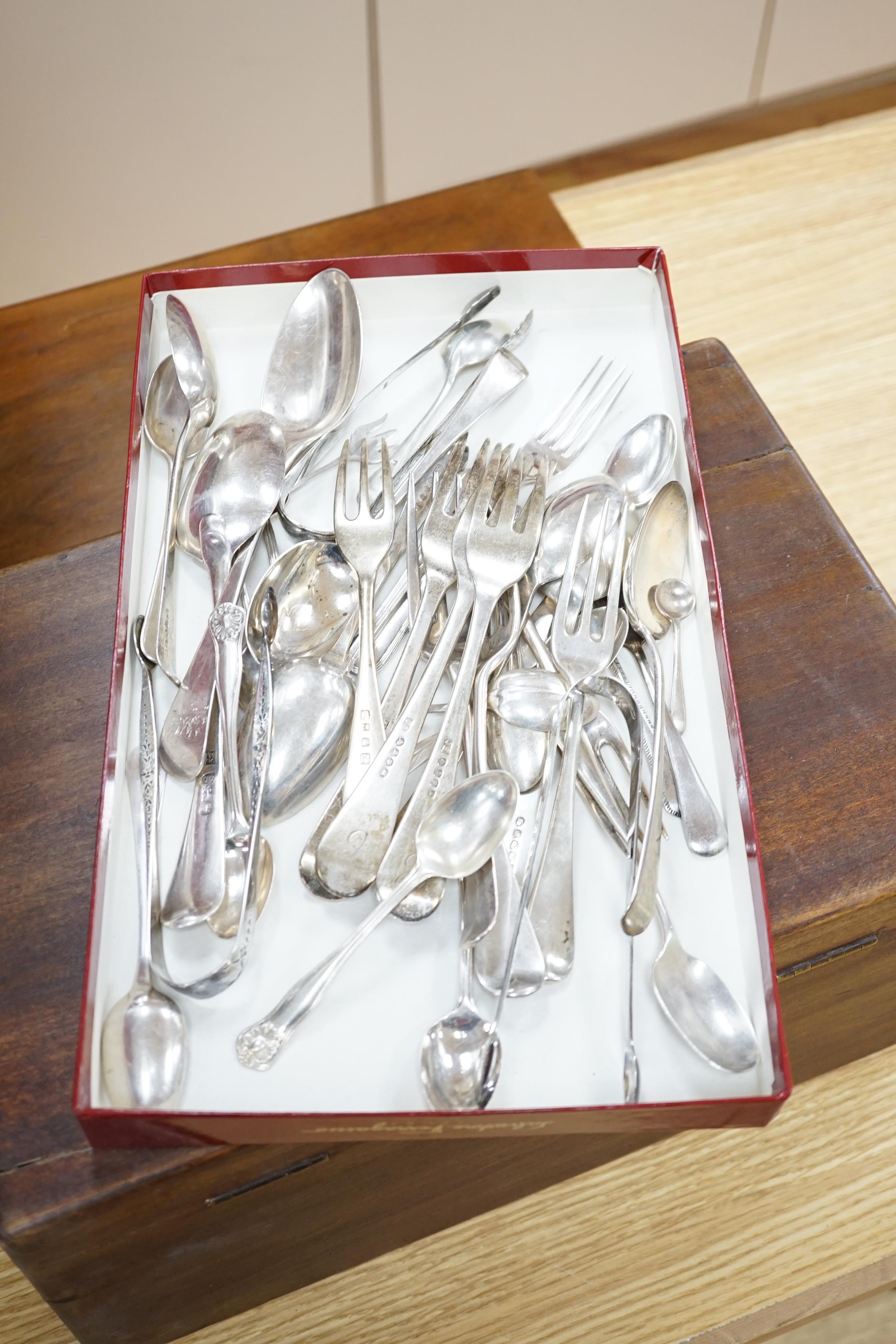 A small quantity of 19th century and later silver flatware, including three pairs of Georgian sugar tongs and nine 19th century and later three pronged forks